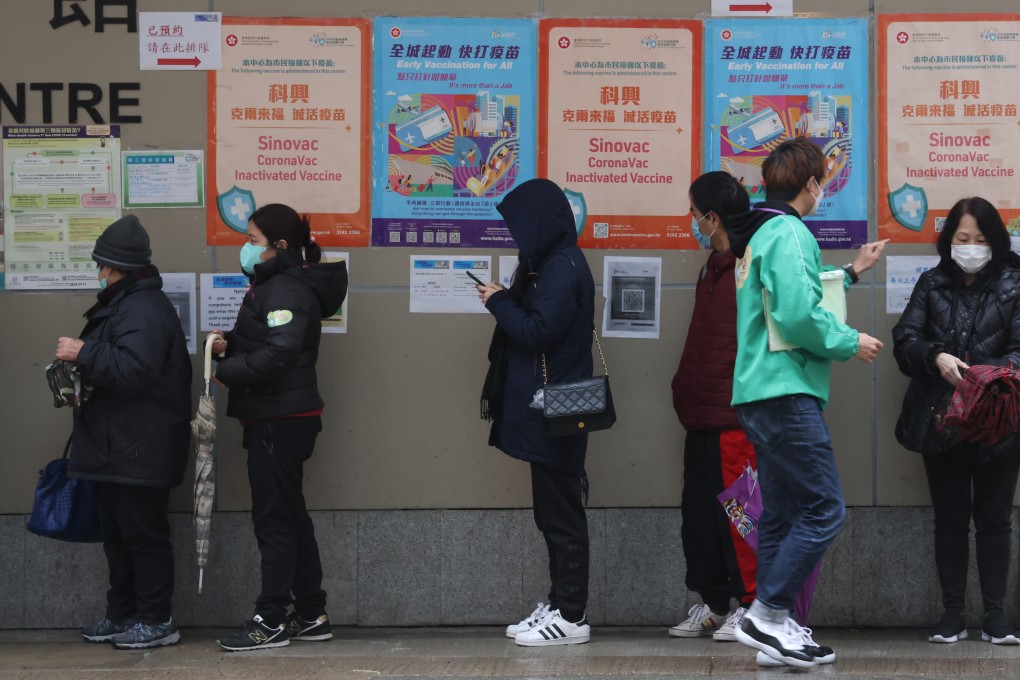 People queue for Sinovac vaccination for coronavirus at Java Road Sports Centre in North Point on 21 February 2022. Photo: May Tse