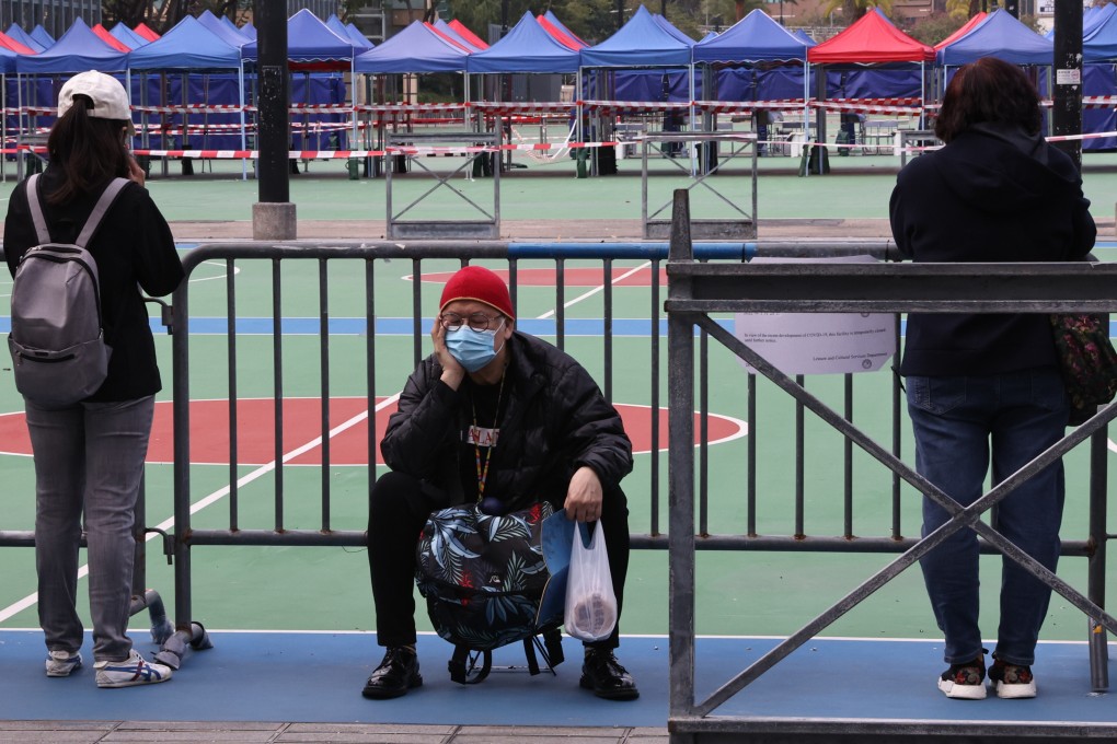 A man rests while queuing for a Covid-19 test in Victoria Park in Causeway Bay on February 28. Photo: K.Y. Cheng