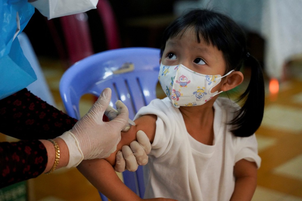 A child receives a vaccine against Covid-19. Photo: Reuters