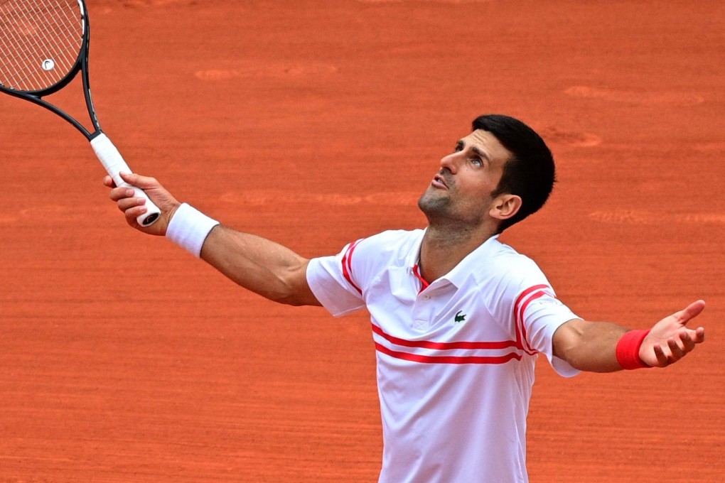 Serbia’s Novak Djokovic reacts after winning a point against Italy’s Lorenzo Musetti during his men’s singles fourth round tennis match at the 2021 French Open in Paris. Photo: AFP