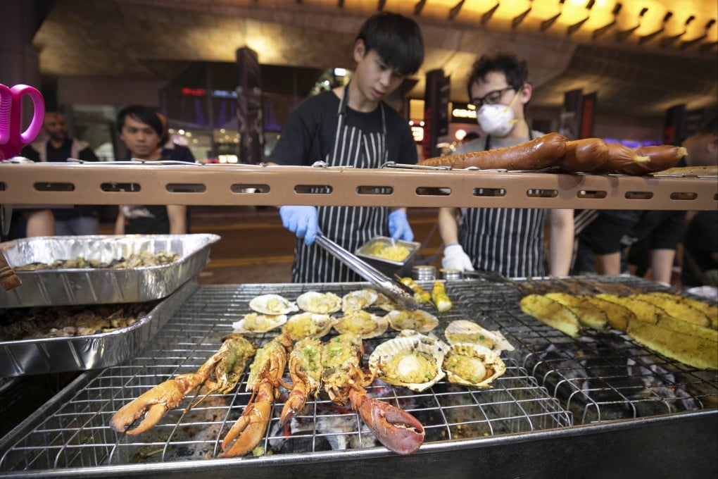 Lunar New Year street food stalls along Portland Street in Mong Kok, Hong Kong. It’s a waste of time when chefs try to elevate such dishes, says the Post’s Andrew Sun. Photo: Antony Dickson