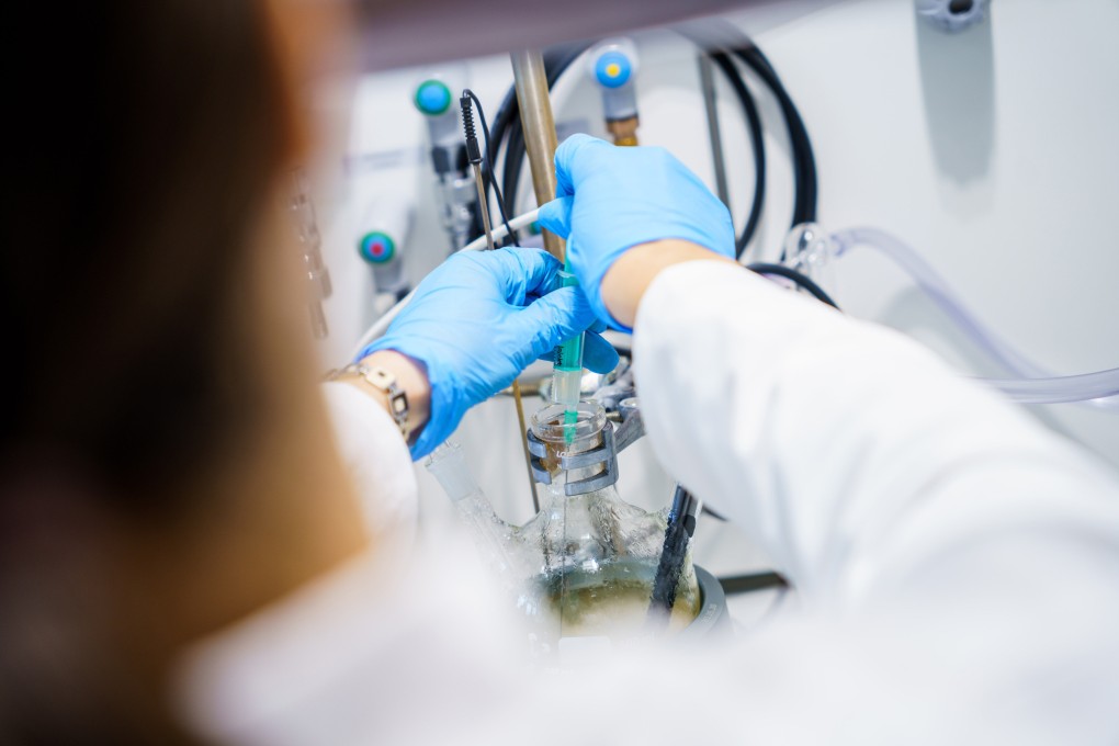 A laboratory technician prepares lithium brine. Photo: Bloomberg