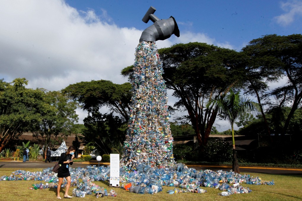A UN delegate looks at a piece dubbed “Turn off the plastic tap” by Canadian activist and artist Benjamin von Wong, made with plastic waste collected from Kibera slums, in Nairobi, Kenya on Monday. Photo: Reuters