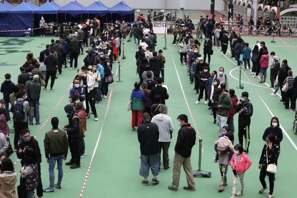 Hong Kong residents wait for coronavirus testing amid a surge in cases. Photo: Jonathan Wong