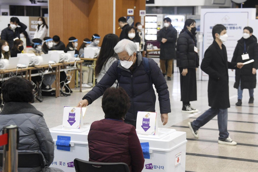 People cast their ballots at a polling station in Seoul, South Korea, on Friday. Photo: Kyodo