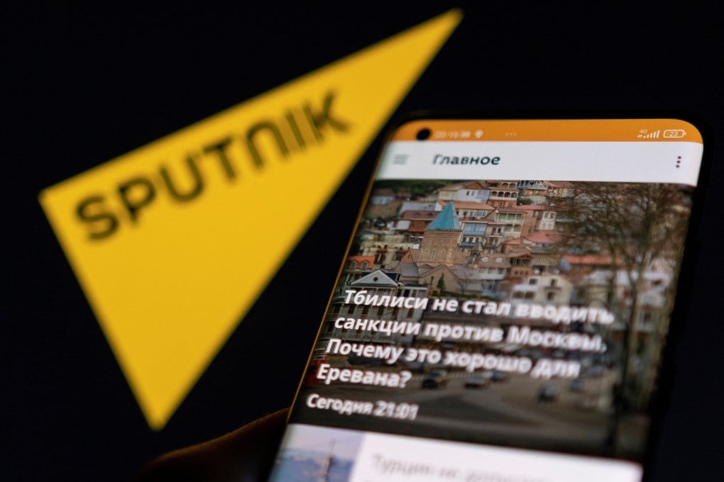 The Sputnik app seen on a smartphone in front of its logo in an illustration taken February 28, 2022. Photo: Reuters