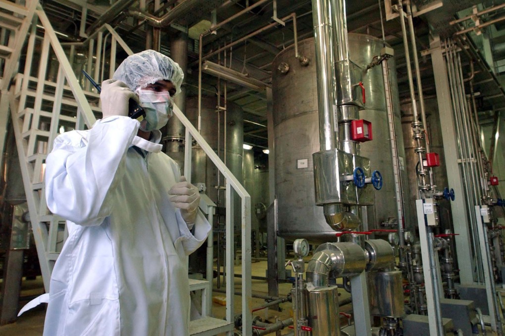 A security officer talks in a part of the Uranim Conversion Facility, just outside the city of Isfahan, Iran, on March 30, 2005. While the world’s attention has been focused on Ukraine, the Biden administration has been racing forward with other global powers towards restoring the 2015 international nuclear deal with Iran. Photo: AP