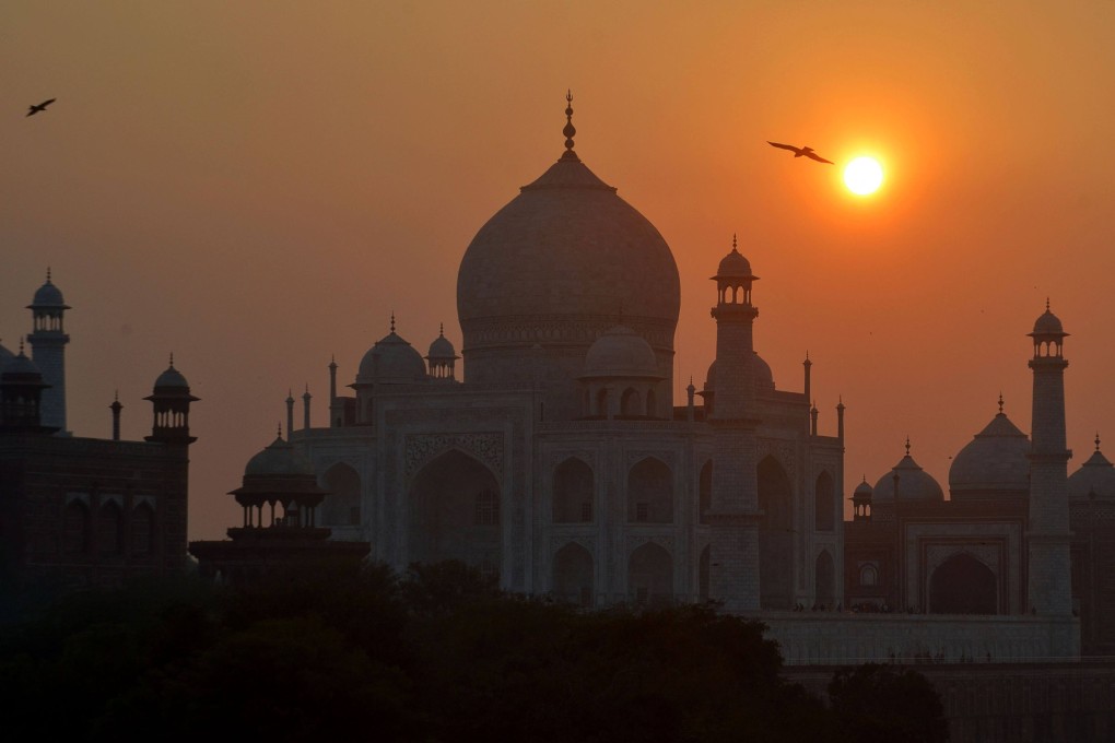 The sun sets over the Taj Mahal in Agra on February 1, 2022. Photo: AFP