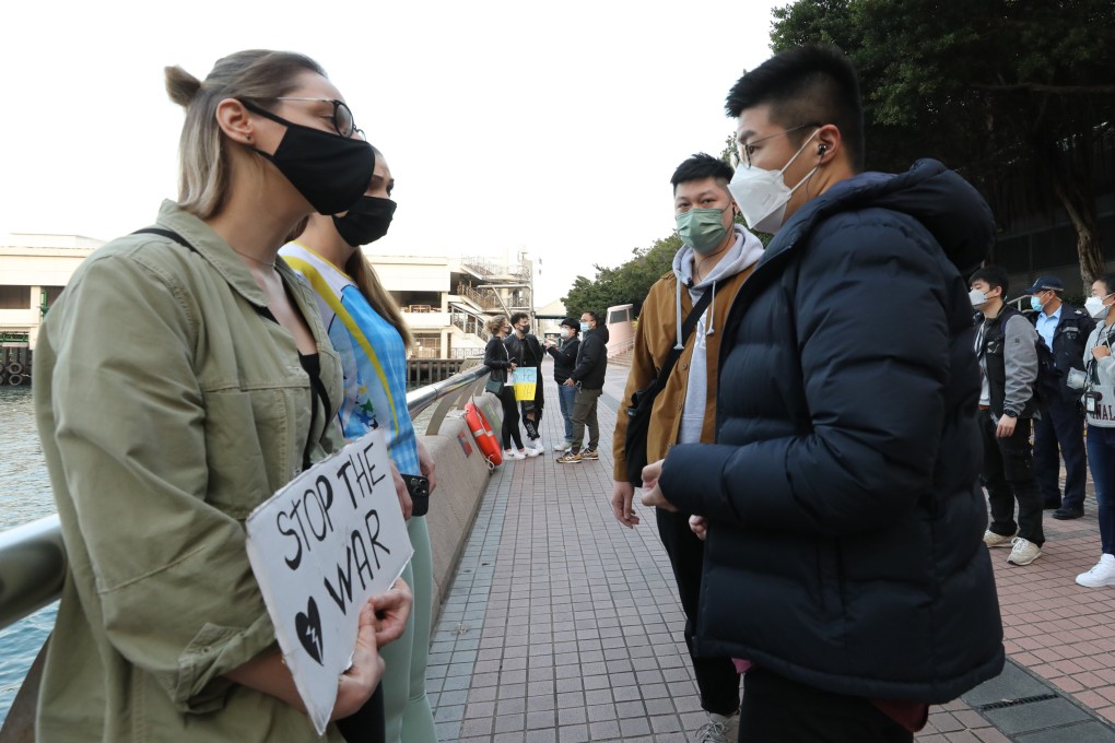 Russians and Ukrainians in Hong Kong protest against the Russian invasion of Ukraine, outside Central Ferry Pier No.3 in Central on February 25. Photo: Jelly Tse