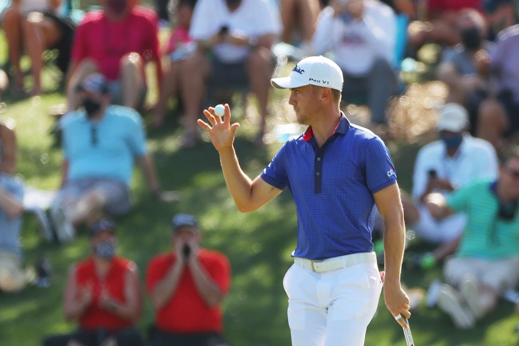 Justin Thomas acknowledges the crowd after his eagle putt on 11 during the final round of The Players Championship. Photo: Getty Images