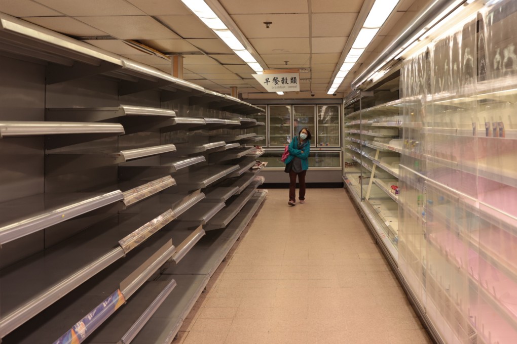 Empty shelves is seen in a supermarket at Sai Wan Ho under the rumour of the city-wide lockdown to be imposed amidst the fifth wave of coronavirus outbreak. Photo: Sam Tsang