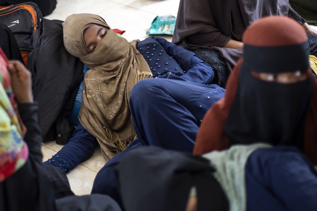 Ethnic Rohingya people rest at a temporary shelter in Bireuen, Aceh province. Photo: AP