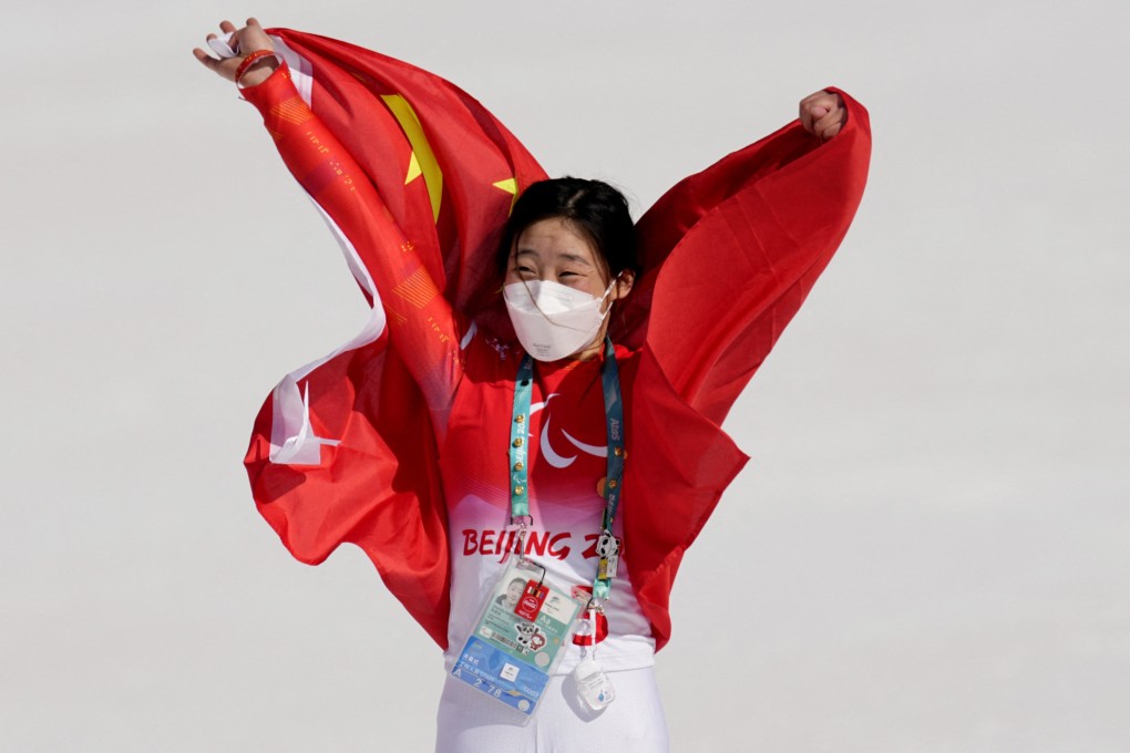 Zhang Mengqiu, of China, celebrates after claiming Paralympic gold in women’s super-G standing. Photo: Reuters