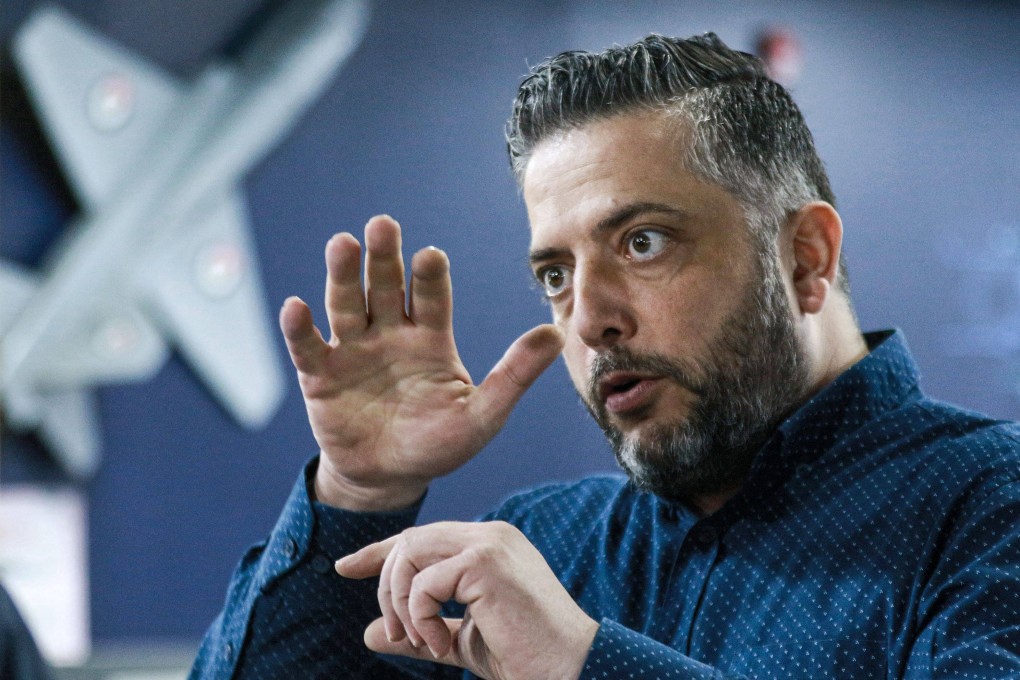 Saliba Taimeh, a 39-year-old Jordanian mechanical engineer pondered how to deal with one contaminated everyday surface: the handrails of escalators in shopping malls and transport hubs. He came up with a device to sterilise them with UV rays in February 2022 Photo: AFP