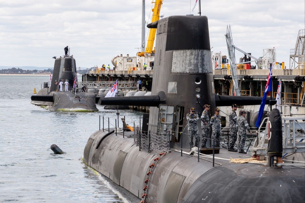 An Australian Collins-class submarine and a British nuclear-powered attack submarine are seen last year at Australia’s existing submarine base in Perth. Photo: EPA