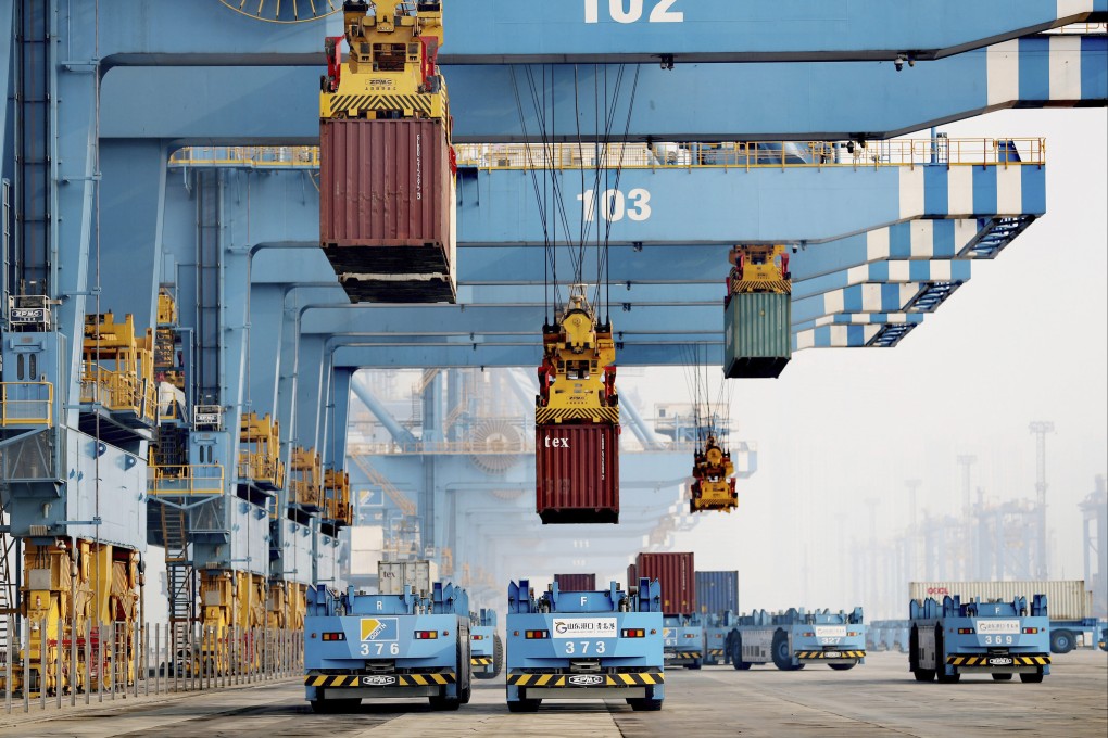 Driverless vehicles move containers at a port in Qingdao in eastern Shandong province in January 2022. Photo: AP