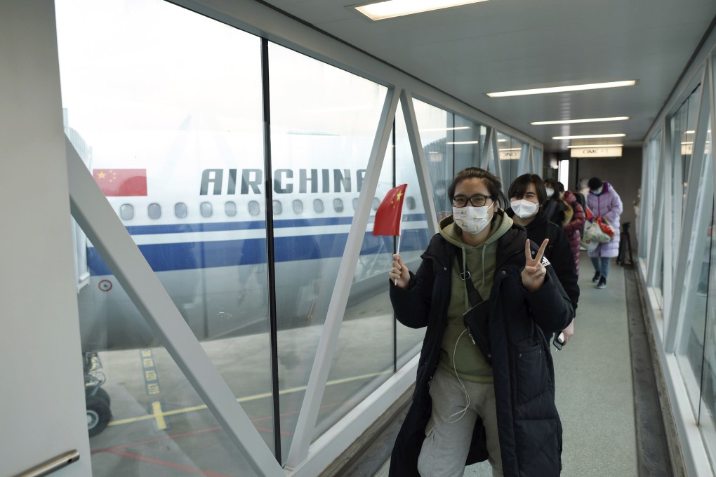 Chinese evacuees from Ukraine walk through a jetway as they arrive at Hangzhou Xiaoshan International Airport in Hangzhou, China’s Zhejiang Province, March 5, 2022. Photo: Xinhua via AP