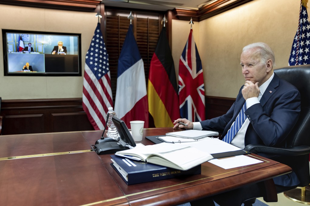 US President Joe Biden listens during a video call with French President Emmanuel Macron, German Chancellor Olaf Scholz and British Prime Minister Boris Johnson on Monday as the leaders discussed the Russian invasion of Ukraine. Photo: The White House via AP