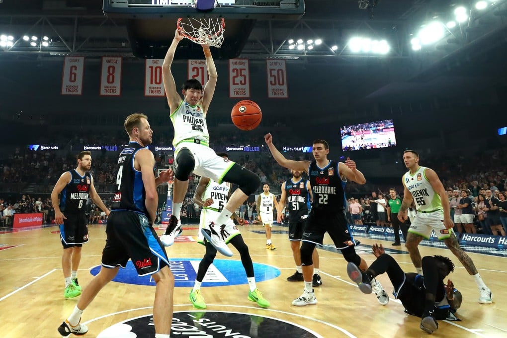 Zhou Qi of the Phoenix slam dunks during the round two NBL match between Melbourne United and South East Melbourne Phoenix. Photo: Getty Images