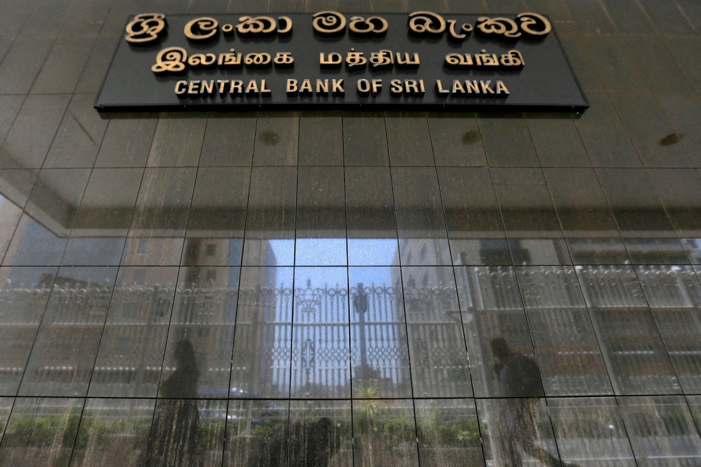 People walk past the main entrance of the Sri Lanka’s Central Bank in Colombo, Sri Lanka in March 2017. Photo: Reuters