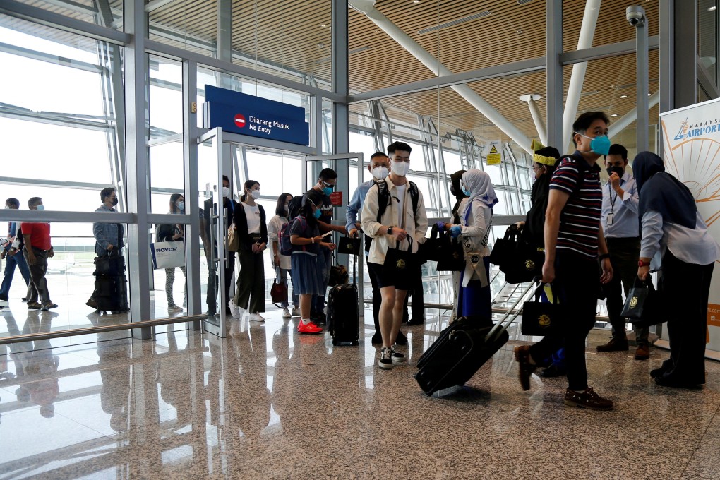 Travellers arrive at Kuala Lumpur International Airport in November 2021. Malaysia will reopen its borders to international travel April 1. Photo: Reuters