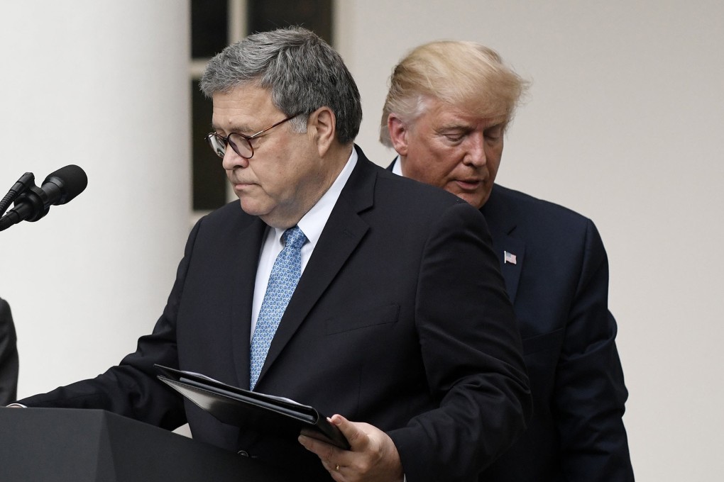 US President Donald Trump (right) and US Attorney General William Barr look on during a news conference in the Rose Garden at the White House in July 2019. Photo: TNS