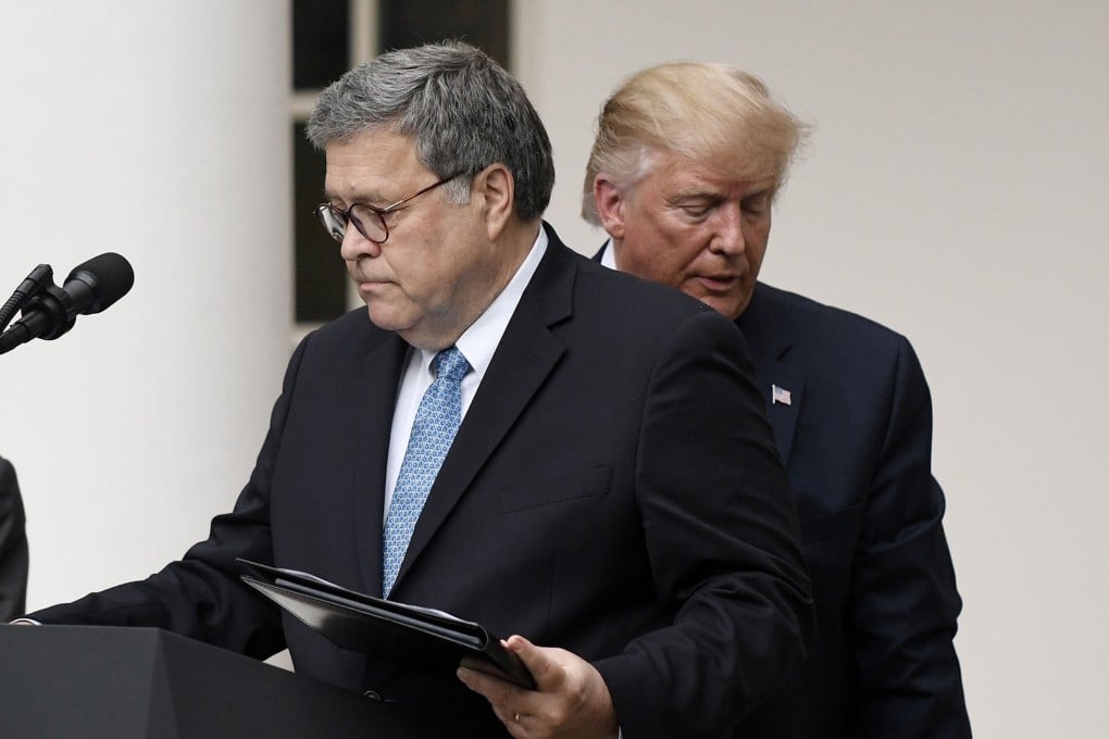 US President Donald Trump (right) and US Attorney General William Barr look on during a news conference in the Rose Garden at the White House in July 2019. Photo: TNS