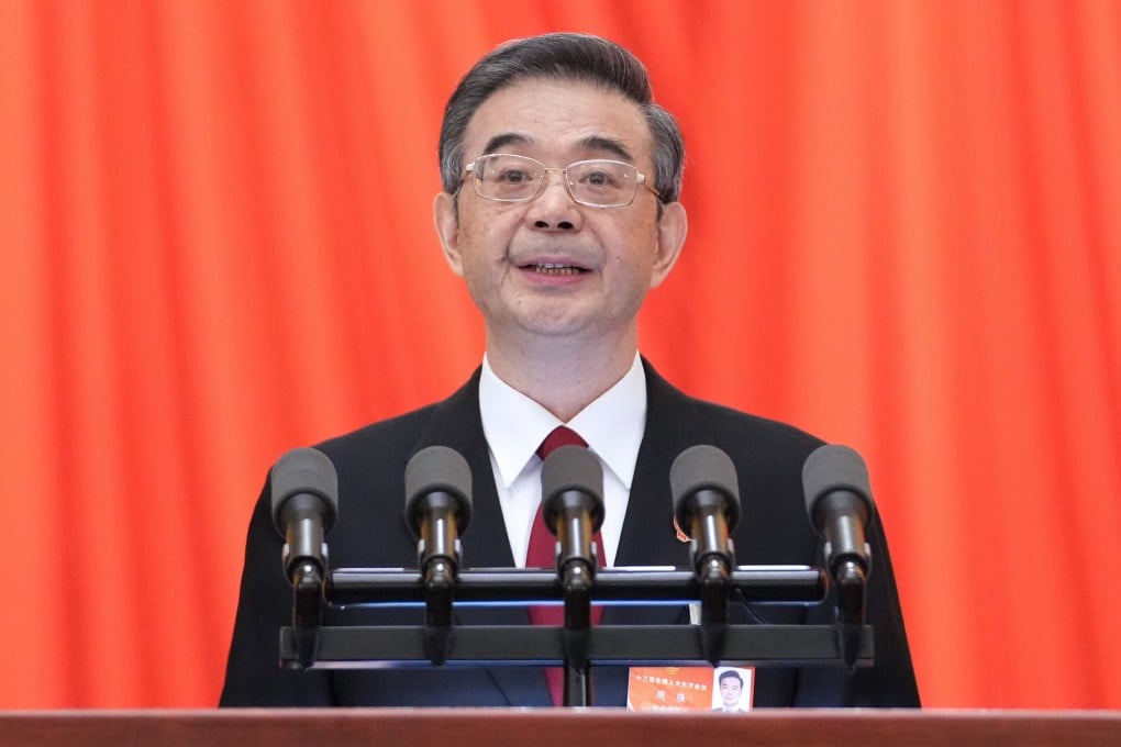 Chief Justice Zhou Qiang delivers the top court’s work report in Beijing on Tuesday. Photo: Xinhua