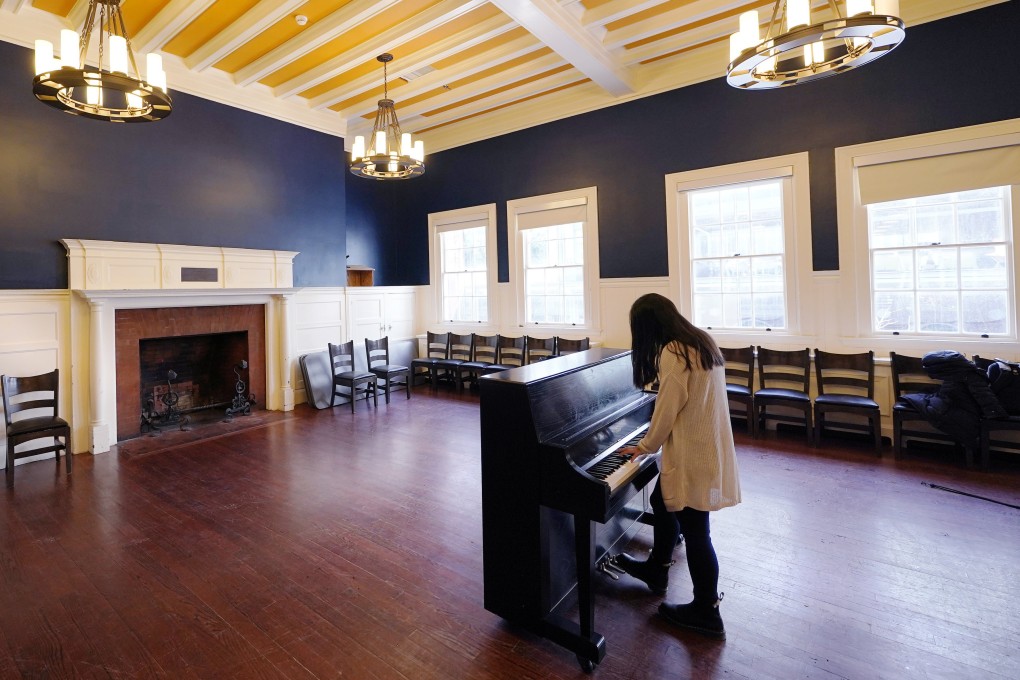 Julia Riew plays piano at Farkus Hall on the campus of Harvard University. The Korean-American student has written a musical about a Korean princess and released snippets of it on TikTok. Photo: AP