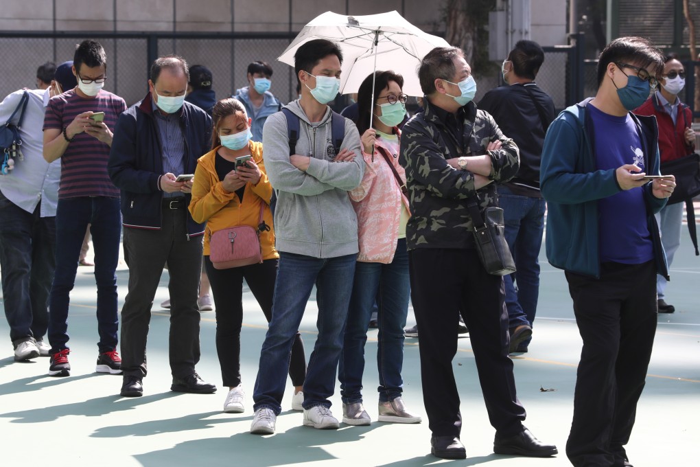 People queue for Covid-19 testing at a mobile specimen collection station in Mong Kok earlier this month. Photo: Jonathan Wong