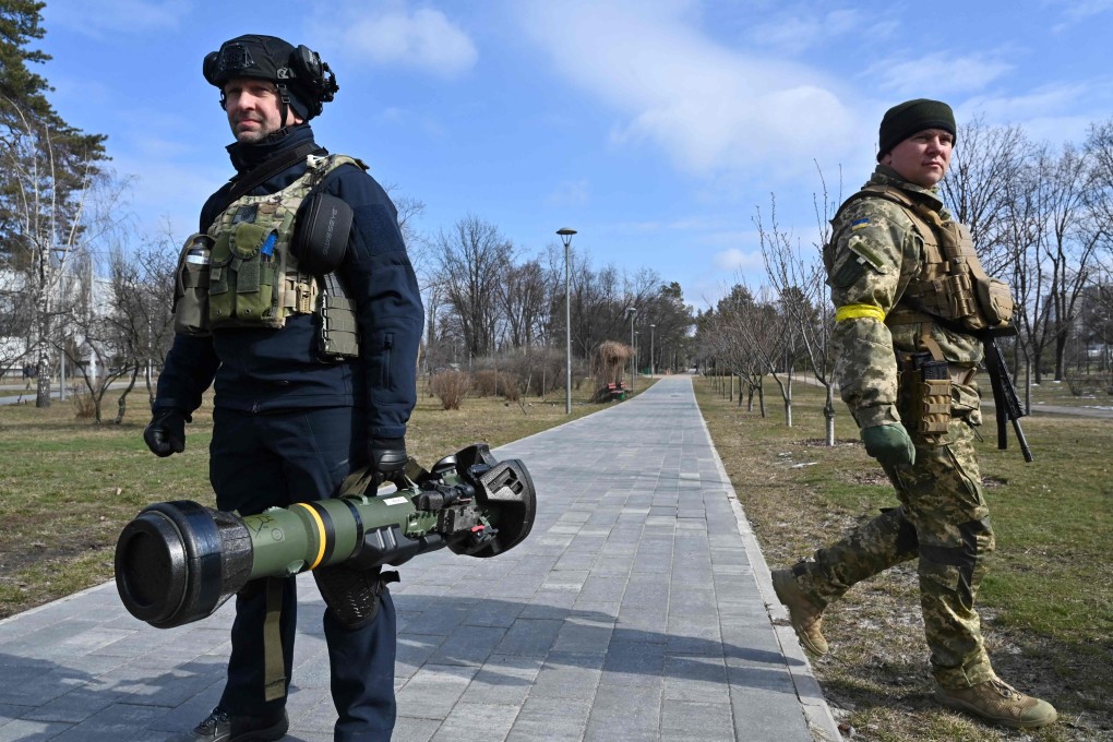 Ukrainian Territorial Defence Forces examine new weapons in Kyiv on Wednesday amid Russia’s ongoing invasion of Ukraine. Photo: AFP