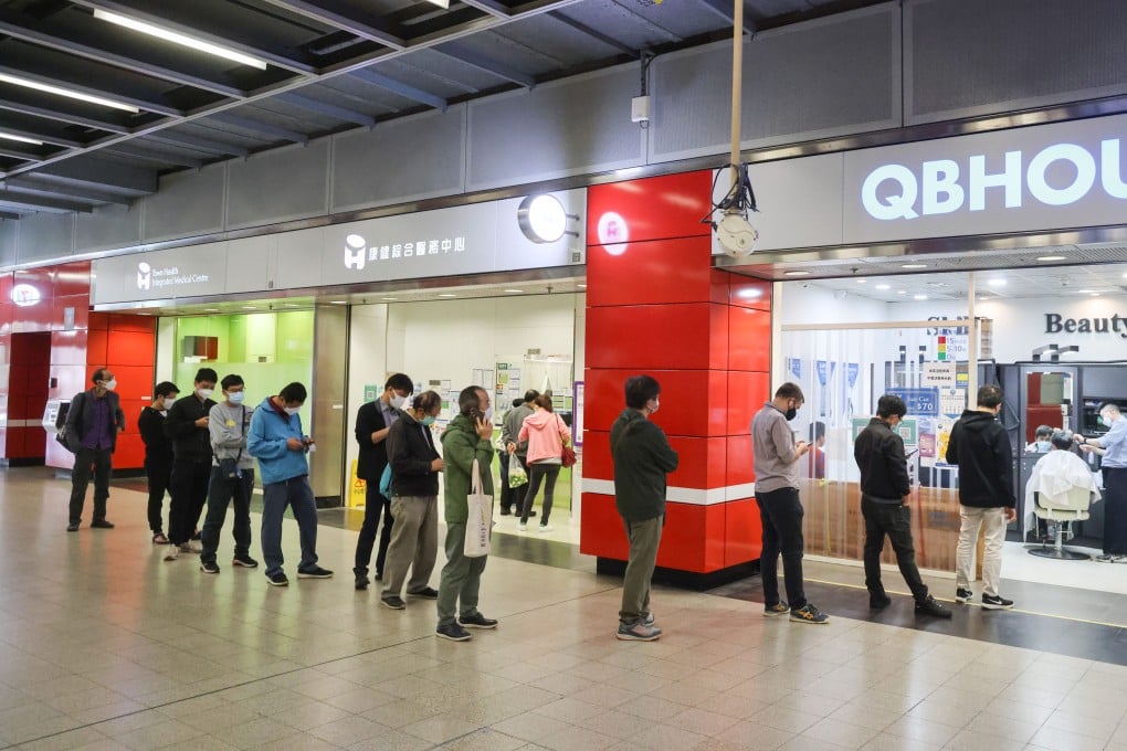 People queue up for a haircut after salons reopened in Hong Kong following a month-long closure. Photo: May Tse