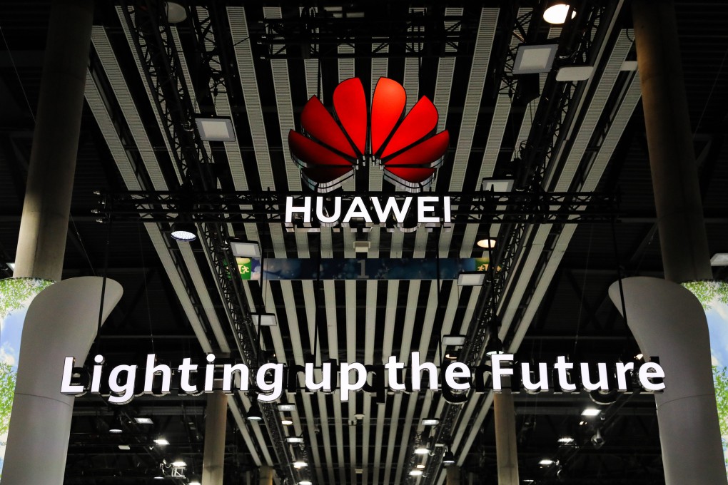 An illuminated logo is seen above the Huawei Technologies Co. stand at the MWC Barcelona in Spain on FEbruary 28. Photo: Bloomberg