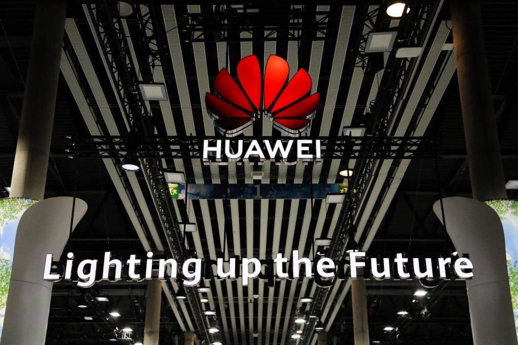 An illuminated logo is seen above the Huawei Technologies Co. stand at the MWC Barcelona in Spain on FEbruary 28. Photo: Bloomberg