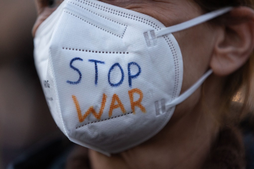 A protester in Germany, against Russia’s invasion of Ukraine. The war has raised the risk of an escape of disease-causing pathogens from Ukraine’s labs. Photo: AFP