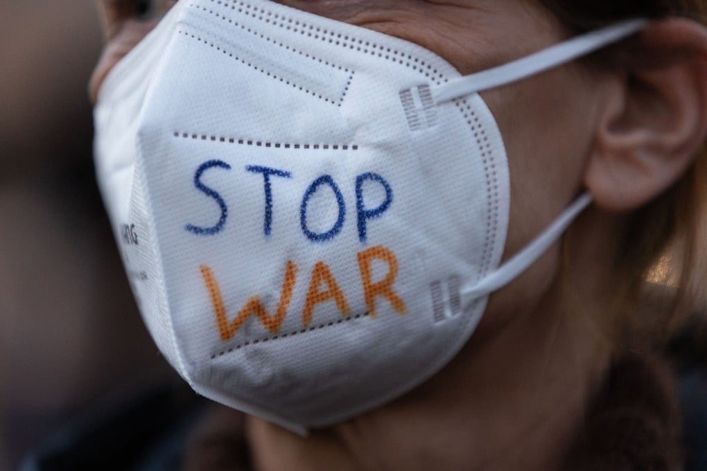 A protester in Germany, against Russia’s invasion of Ukraine. The war has raised the risk of an escape of disease-causing pathogens from Ukraine’s labs. Photo: AFP