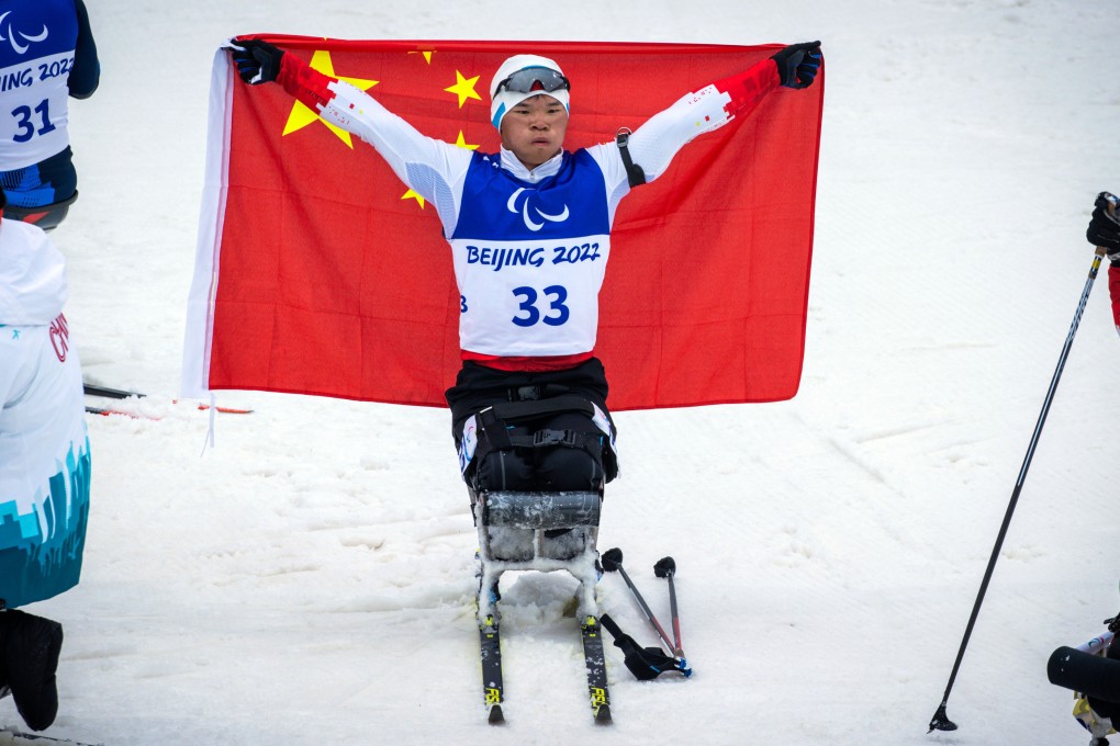 Liu Mengtao celebrates winning the gold medal after the men’s para biathlon 12.5km sitting event. Photo: dpa