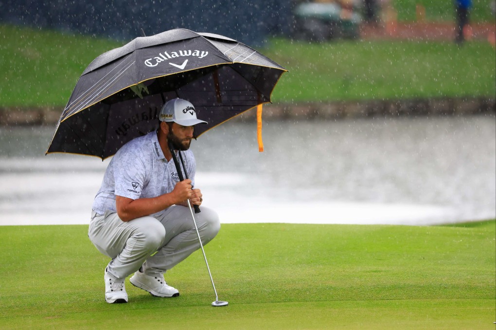 Jon Rahm lines up a putt on the 16th green during the first round of The Players Championship in Florida. Photo: AFP