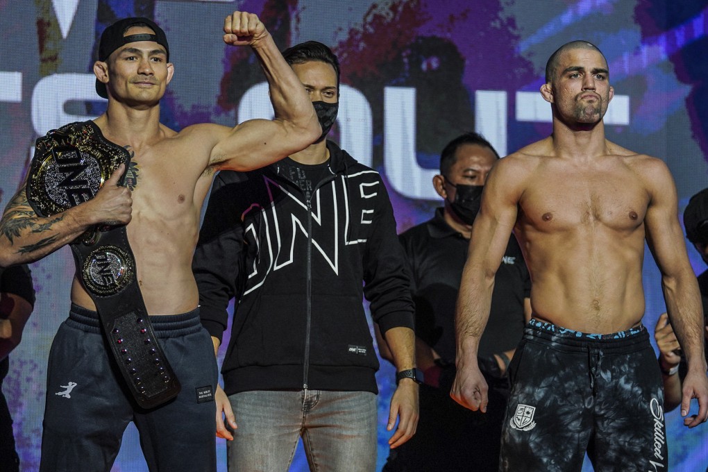 Thanh Le and Garry Tonon pose for pictures at the ONE: Lights Out ceremonial weigh-ins. Photos: ONE Championship