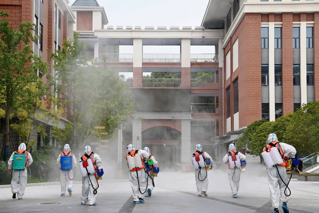 Workers disinfect the compound of a primary school in Wuhan, China’s Hubei province. File photo: Reuters