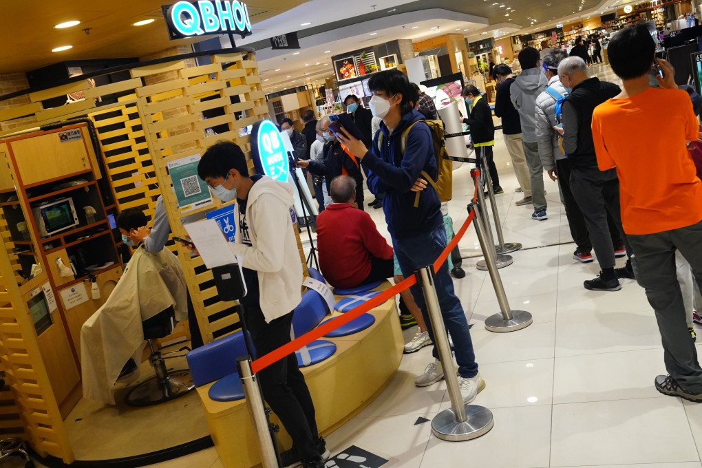 People queue up in Kornhill, Quarry Bay, on March 10, the first day of the reopening of barber shops and hair salons under Hong Kong’s Vaccine Pass scheme. There should now be a similar relaxation for beauty parlours, gyms, swimming pools and so on. Photo: Felix Wong