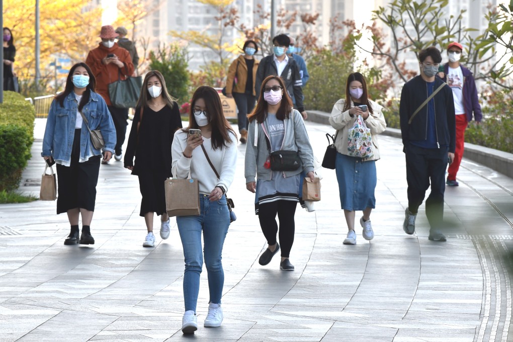 People wearing face masks walk in Tsuen Wan, Hong Kong, on Thursday. Photo: Xinhua