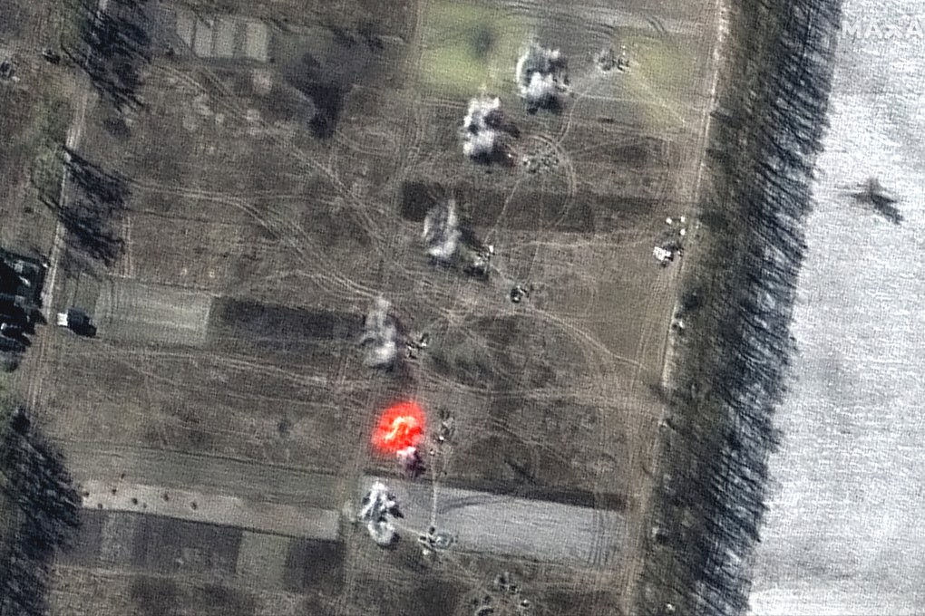 This multispectral satellite image shows an artillery battalion actively firing in a southeasterly direction near Antonov Airport, during the Russian invasion in Ozera, Ukraine, on Friday. Image: Maxar Technologies via AP