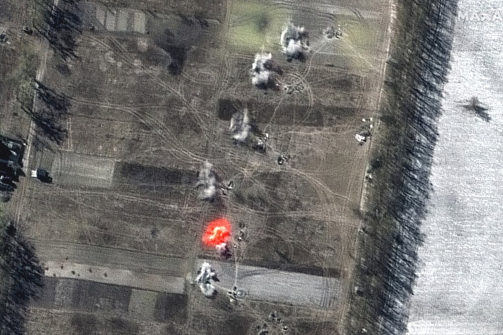 This multispectral satellite image shows an artillery battalion actively firing in a southeasterly direction near Antonov Airport, during the Russian invasion in Ozera, Ukraine, on Friday. Image: Maxar Technologies via AP