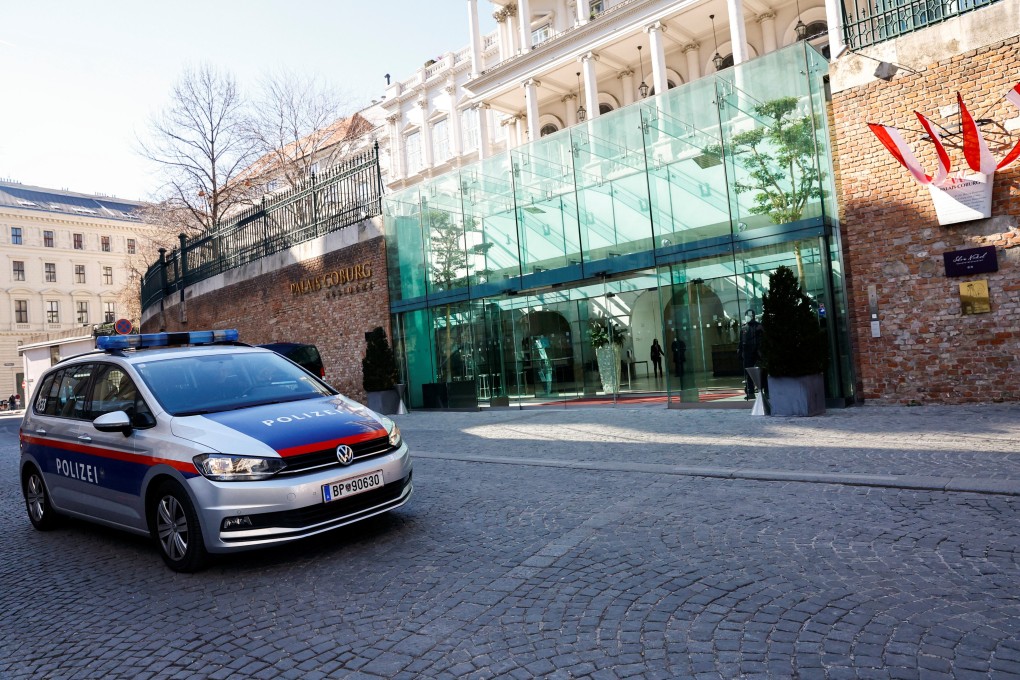 A police car passes the Palais Coburg, site of the closed-door nuclear talks with Iran in Vienna, Austria on Friday. Photo: Reuters