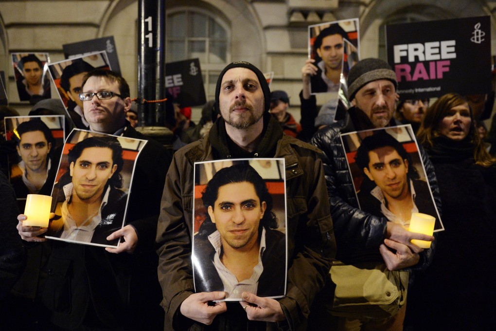 Activists take part in an Amnesty International protest in 2015 against Raif Badawi’s flogging outside Saudi Arabia’s embassy in London. Photo: EPA