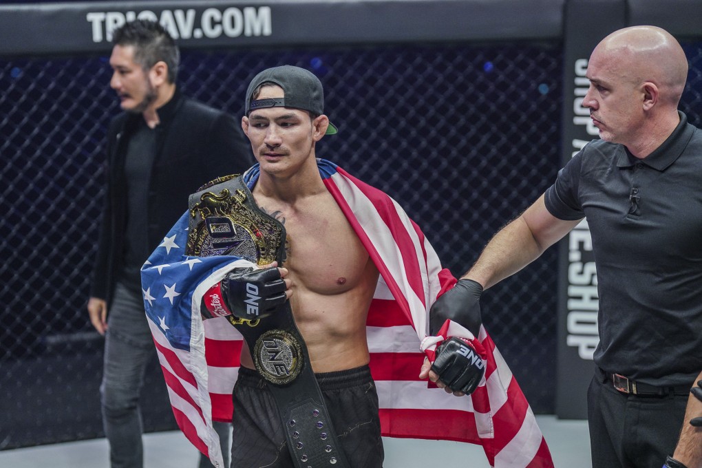 Thanh Le celebrates with his ONE featherweight MMA title after knocking out Garry Tonon. Photos: ONE Championship