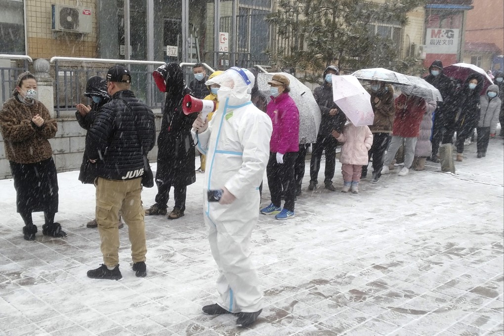 Residents line up in the snow for Covid-19 screening in Changchun, Jilin province. Photo: AP