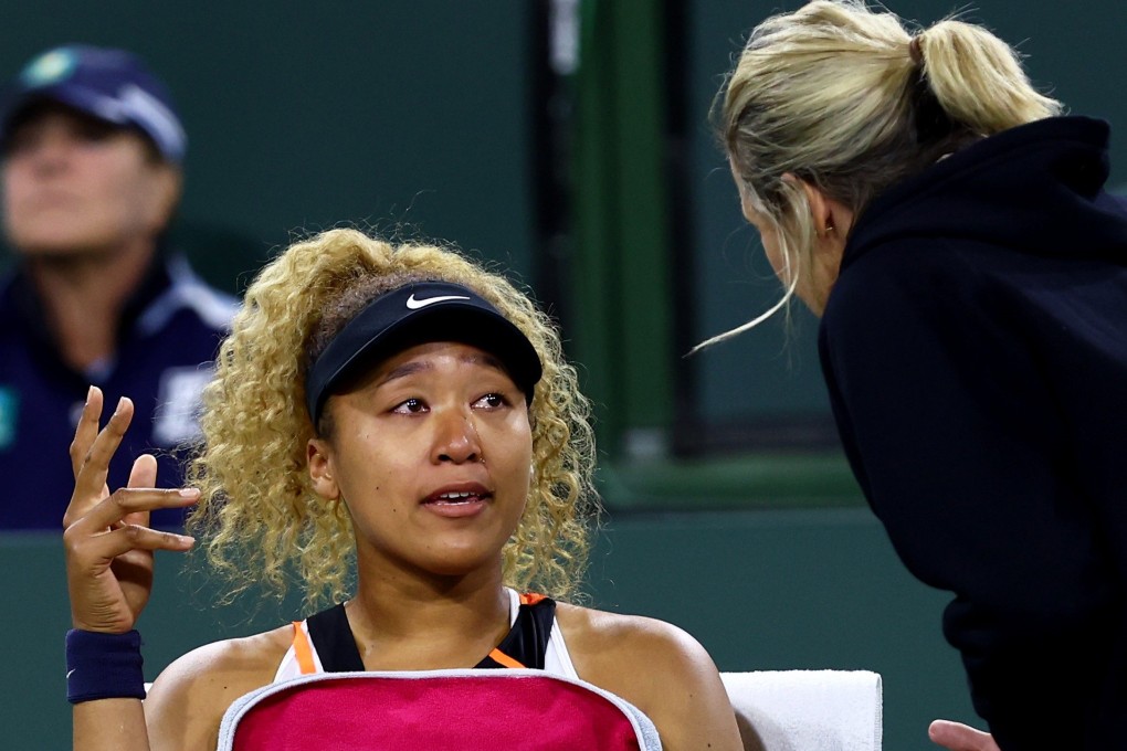 Naomi Osaka cries as she speaks with WTA supervisor Clare Wood at the BNP Paribas Open. Photo: AFP