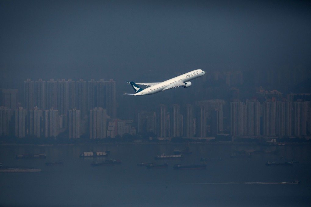 An aircraft operated by Cathay Pacific takes off from Hong Kong airport on January 6. Cathay Pacific reported HK$5.5 billion in losses last year, with services hammered by strict Covid-19 travel curbs. Photo: Bloomberg